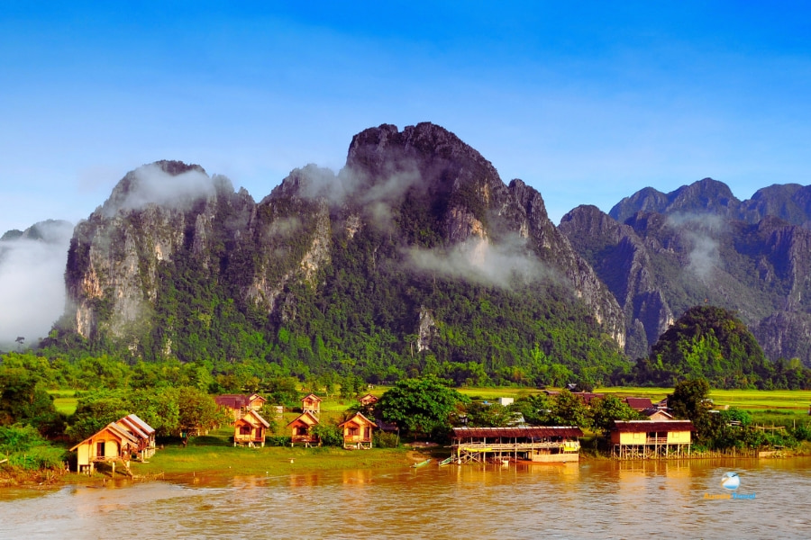 Vang Vieng riverside wooden houses and limestone mountains – Auasia Travel